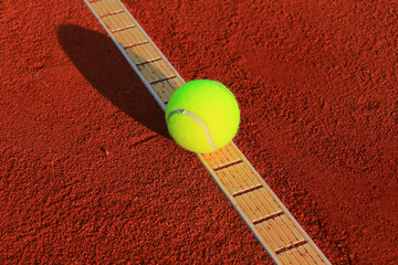 Wall Mural - Tennis balls on a tennis clay court