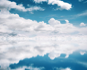 Wall Mural - blue sky reflective on the water background