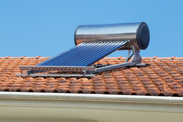 Poster - solar heater on the roof of a house