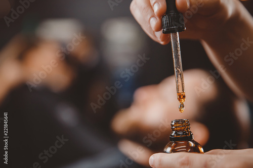 Fotomural Oil for care and growth of beard, barbershop