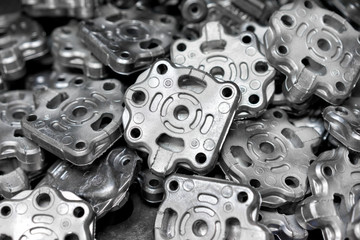 Sticker - Pile of aluminum automotive parts, casting process in the automotive factory