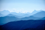 Fototapeta Natura - mountain top panorama in  autumn covered in mist or clouds