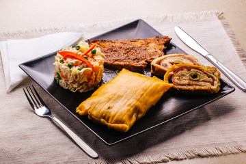 Wall Mural - Christmas dish in Venezuela, hallaca, ham bread, salad and pork