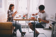 © Criene Images - young couple eating breakfast together in kitchen