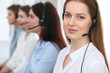 © rogerphoto - Call center. Beautiful cheerful smiling operator consulting clients with headset. Business concept of customer service