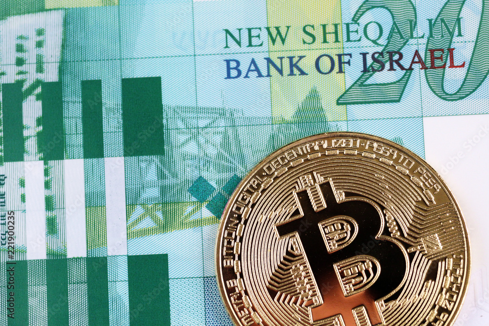 A macro image of a golden bitcoin with a 20 Israeli bill close up