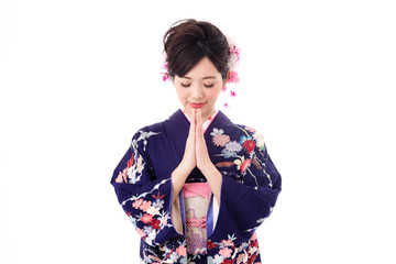 portrait of young asian woman wearing purple kimono on white background