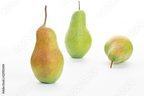 green ripe pear on white background