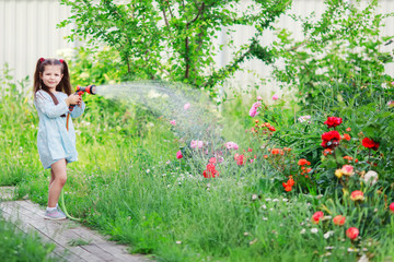 Wall Mural - Mothers little helper having fun in the garden