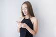 © fufupix - Close up of Asian business woman in black dress Laughing and touching a smartphone, beauty face,