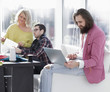 © yurolaitsalbert - fashion designer working on a laptop in a creative office