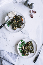 Plates With Seaweed And Spinach Salad