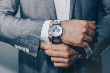 businessman luxury style. men style.closeup fashion image of luxury watch on wrist of man.body detai
