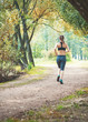 © darkbird - Active beautiful woman running in the park. Healthy lifestyle