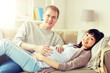 © Syda Productions - pregnancy, family and people concept - happy pregnant wife with husband at home