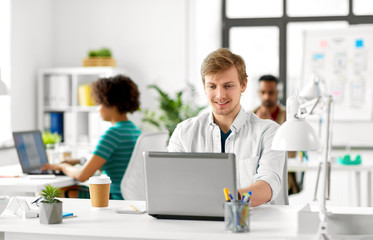 Wall Mural - business and creative people concept - male office worker with laptop computer networking