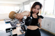 © nut - Portrait of pretty sporty girl asia woman holding weights boxing