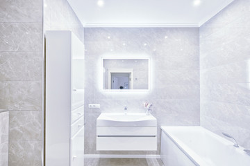 The interior of the bathroom in white modern house.