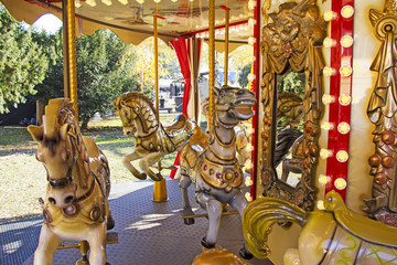 Old fashioned french carousel with horses