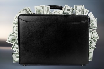 Wall Mural - Black suitcase full of banknotes on backgrouund