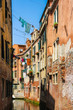 © Spectral-Design - View on the historic architecture and the canal between the ancient buildings in Venice, Italy on a sunny day.