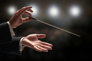 Conductor conducting an orchestra