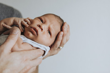 Wall Mural - closeup of a little baby with an upset face