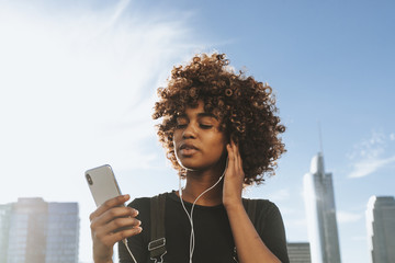 Girl listening to music from her phone