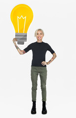 Wall Mural - Happy woman holding a light bulb icon