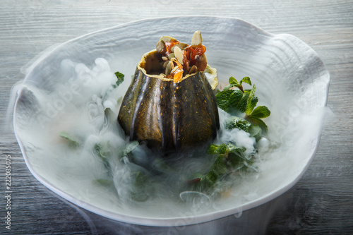 Fotografie, Obraz delicious dessert served in pumpkin decorated with mint and smoke