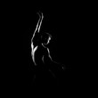 © Acronym - Black and white silhouette of male ballet dancer.