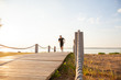 Full length shot of healthy young man running on the promenade. Male runner sprinting outdoors