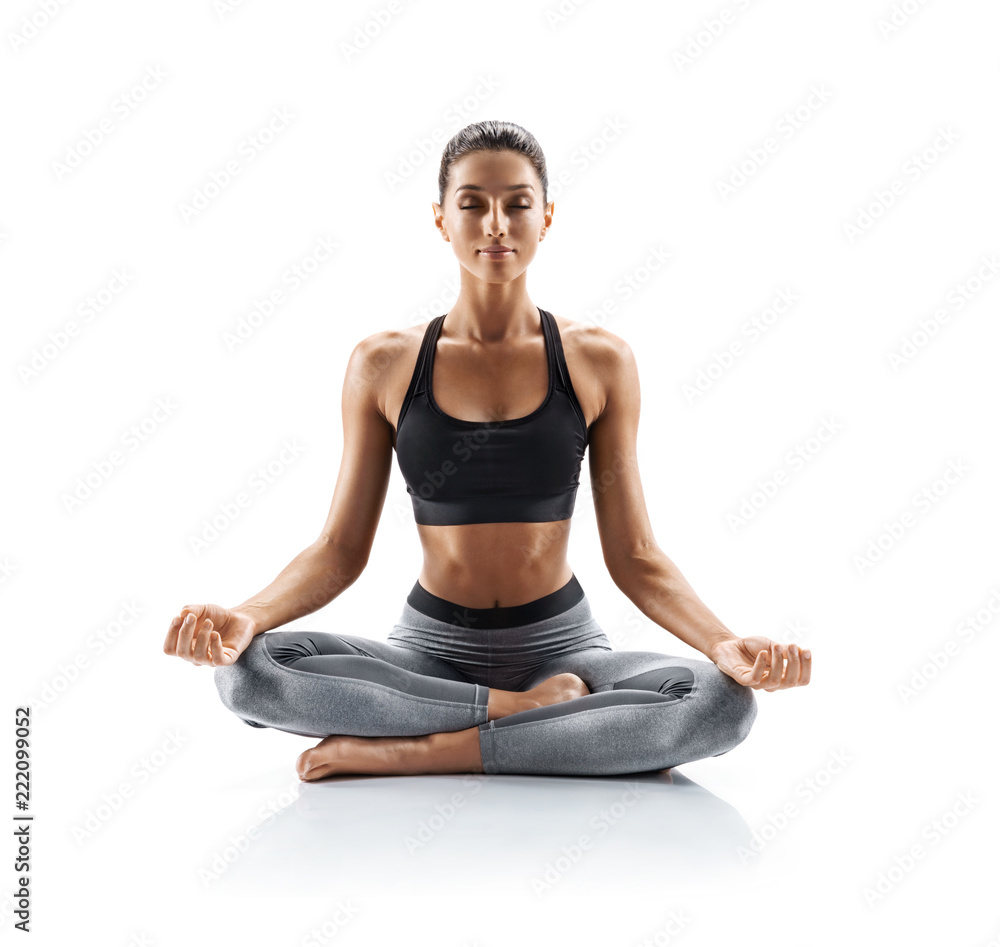 Sporty young woman doing yoga practice isolated on white background. Concept of healthy life and natural balance between body and mental development. Full length - obrazy, fototapety, plakaty 