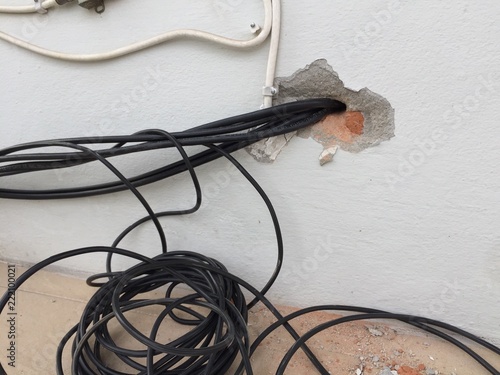 Break In The Wall With Protruding Electrical Wires Electric