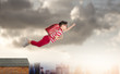 Back to school! Happy cute industrious child flying on sunset sky. Concept of education and school.