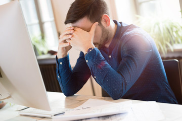 Wall Mural - Portrait of tired overworked architect in office