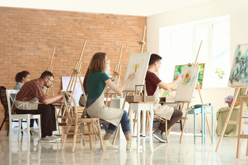 Wall Mural - Group of people during classes in school of painters