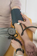© LStockStudio - Doctor Measuring Blood Pressure