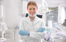 Young Female Dentist In Clinic