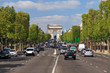 Lots of traffic on a normal spring day at the Champs-Elysees in Paris, France
