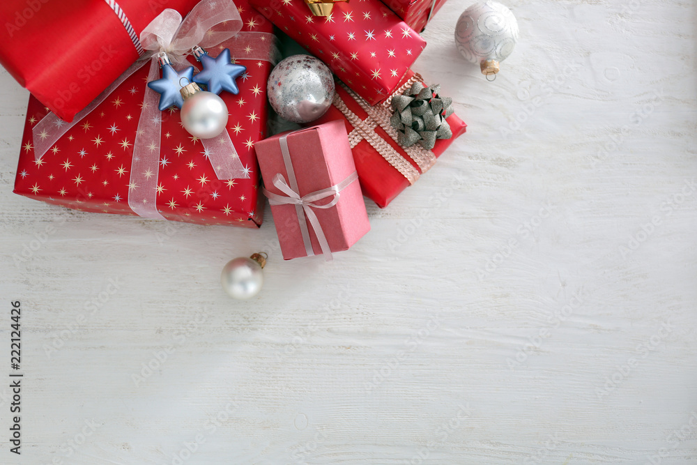 Beautiful Christmas gift boxes on white wooden table