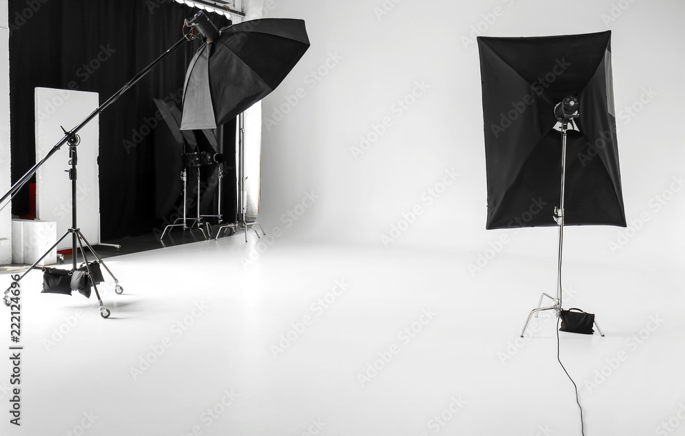Interior of modern photo studio with professional equipment