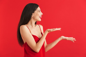 Wall Mural - Portrait of a cheerful young woman in dress