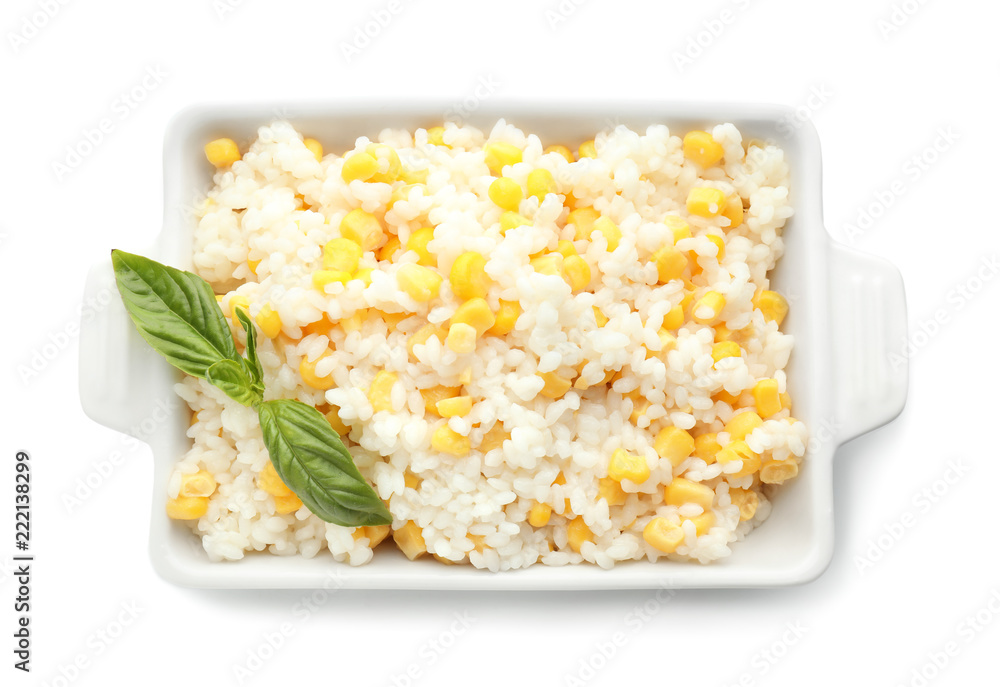 Dish with tasty boiled rice and corn kernels on white background