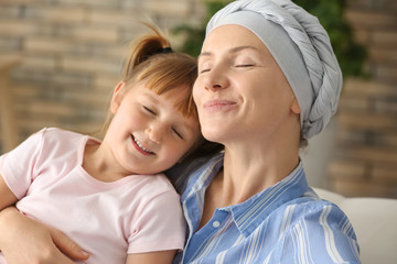 Sticker - Little girl and her mother after chemotherapy at home