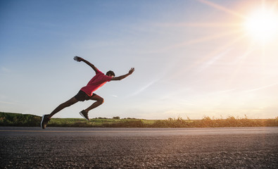 Wall Mural - Athlete runner feet running on road