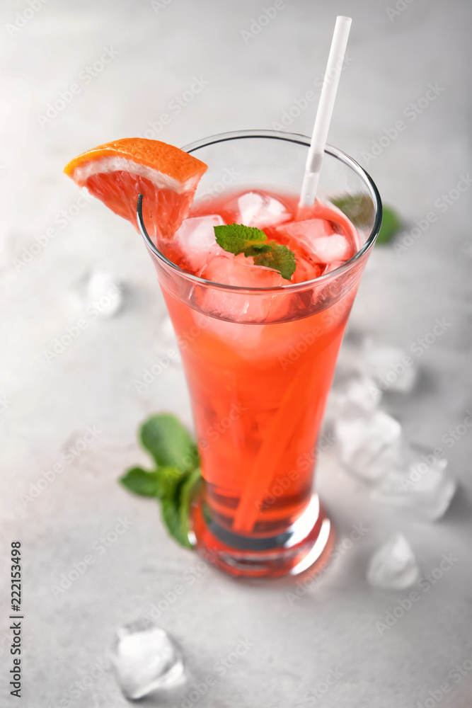 Fresh summer cocktail in glass on light table