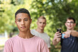 Bullied African-American teenage boy outdoors