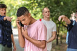 Bullied African-American teenage boy  calling for help outdoors