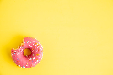 pink donut in colorful background